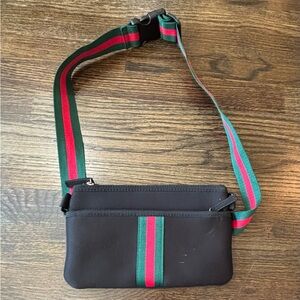 Stylish Black Crossbody Bag with Green and Red Accents